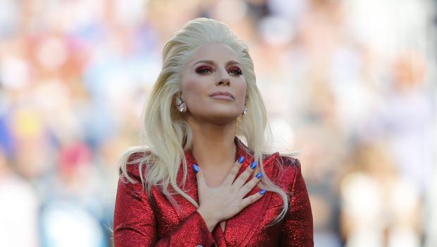 Lady Gaga places her hand over her heart after singing the U.S. National Anthem before the start of the NFL's Super Bowl 50 football game between the Carolina Panthers and the Denver Broncos in Santa Clara, California February 7, 2016.   REUTERS/Mike Blake