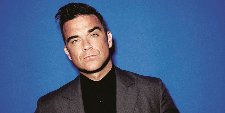 Robbie Williams, hasta las manos